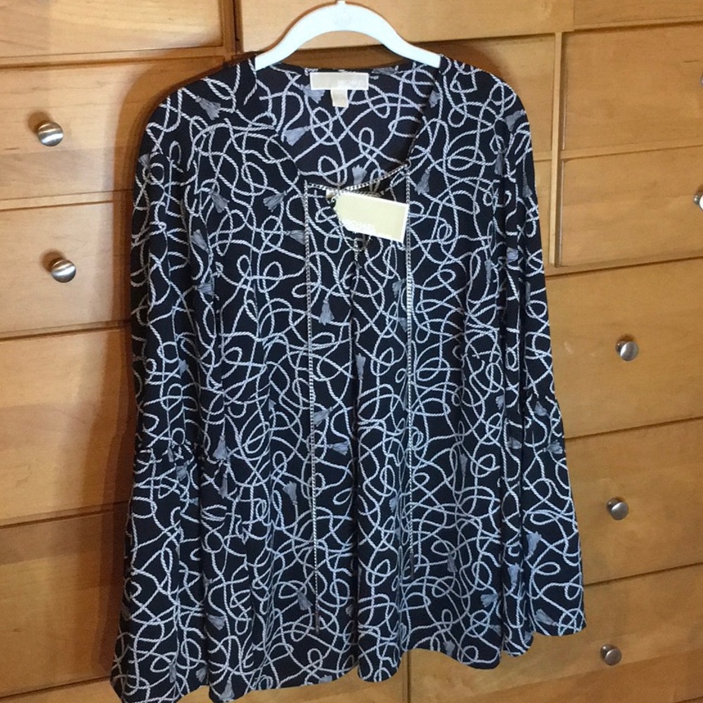 Bell sleeved blouse with chain detail.